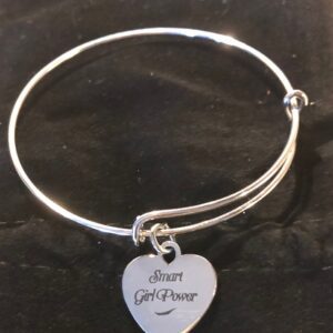 Elegant silver bangle on black background