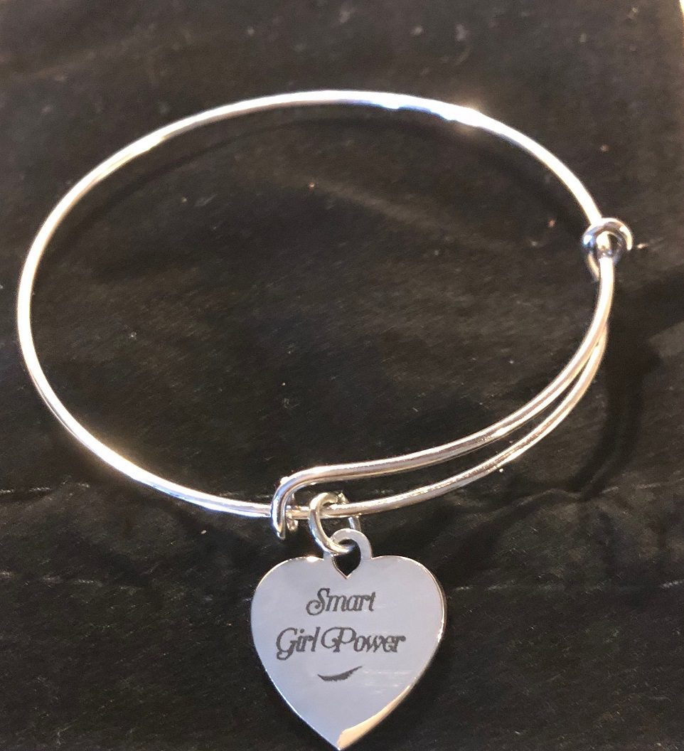 Elegant silver bangle on black background