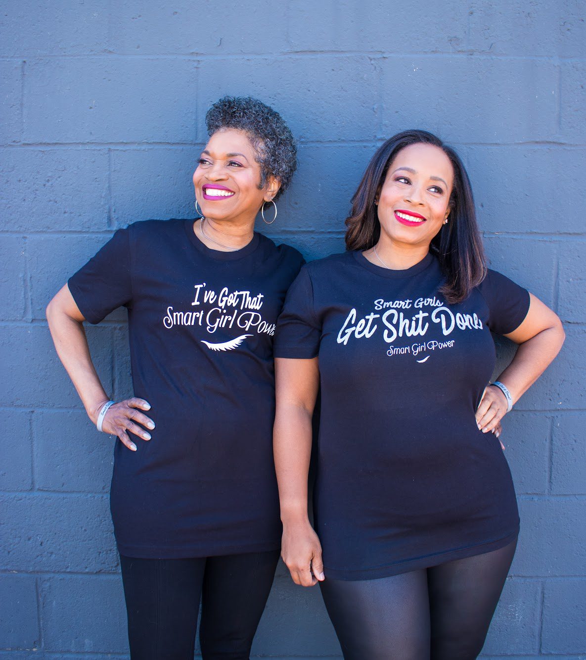 Two women in matching empowerment shirts