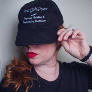 Red-haired woman with hat and red lipstick