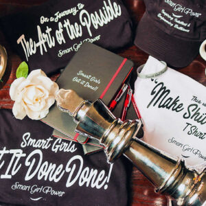Smart Girl Power themed items on table