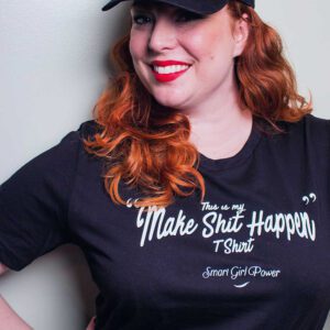 Confident woman in casual attire with slogan
