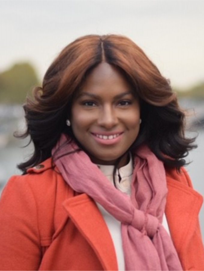 Smiling woman with wavy hair outside